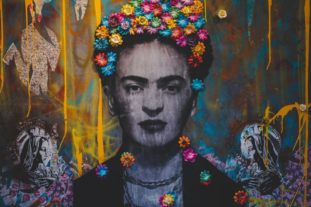 Creative artwork with Frida Kahlo painting decorated with colorful floral headband on graffiti wall